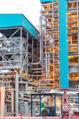 Industrial power plant complex at dusk