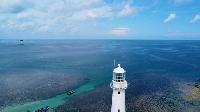 Aerial view of Lengkuas Islet white Lighthouse  in Belitung of Bangka Belitung