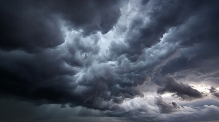 Obraz premium Dark stormy sky with heavy clouds gathering before rainfall, dramatic moody weather scene