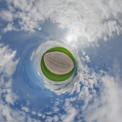 simple little tiny planet without buildings in blue sky with sun and beautiful clouds....
