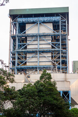 Industrial Power Plant Structure Amidst Green Trees