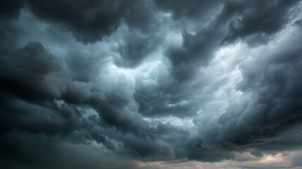 Obraz premium Dark stormy sky with heavy clouds gathering before rainfall, dramatic moody weather scene
