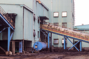 Industrial facility with conveyor belt and equipment