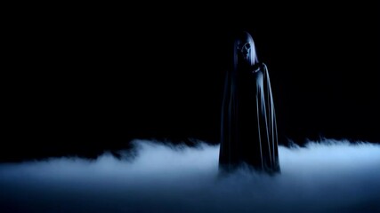 Rocket ascends through misty clouds against a dark sky in dramatic night launch sequence