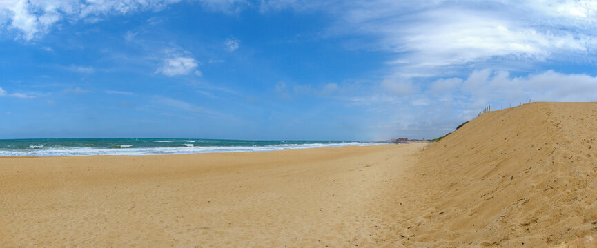 Capbreton beach in France, wide panoramic picture showing the golden sandy beach with blue skies. Tourism and surf location in the south west of France. 