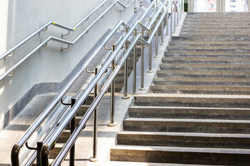 A staircase featuring a sturdy metal railing for added safety and style