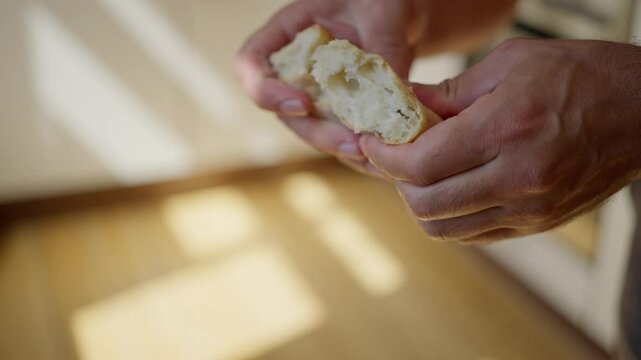 Freshly Baked Bread Being Torn Apart in a Delicious and Comforting Manner and Style. Slow motion