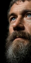 Obraz premium Close up Portrait of a Mature Man with Beard Praying Dramatic Lighting High Resolution