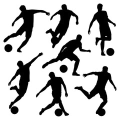 Silhouettes of soccer players kicking soccer balls