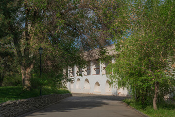 A picturesque park on the territory of the Astrakhan Kremlin against the background of a fortress...