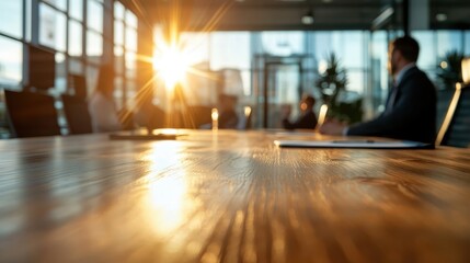 Fototapeta premium A picturesque sunrise floods a modern office space with warm light, highlighting a polished wooden table and creating a scene of inspiration and productivity for the day ahead.