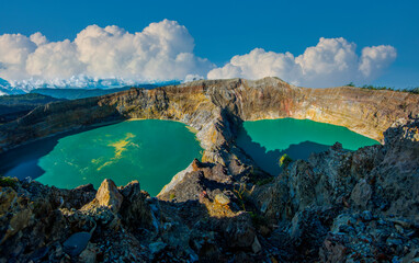 Indonesia, Kelimutu National Park, Flores Island. Volcanic craters with green water due to chemical...
