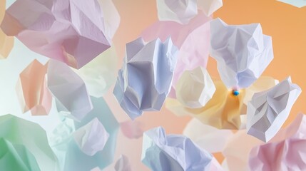 Colorful crumpled paper pieces in mid-air.