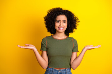 Portrait of a young woman gesturing with a cheerful expression in a casual outfit against a vibrant...