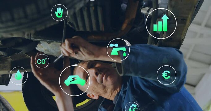 Automotive mechanic under lift grabbing ratchet and loosening plug with CO? icons for eco service