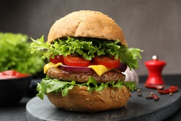 Delicious hamburger with patty served on table, closeup