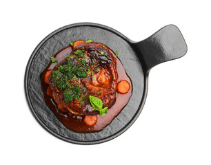Traditional ossobuco dish with beef steak, sauce and vegetables isolated on white, top view