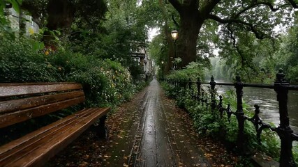 Rainy Day Walk Along Regent's Canal in London, Featuring a Bench and Lush Greenery