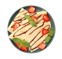 Tasty crepes with strawberries, chocolate sauce and mint isolated on white, top view