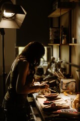 Pastry chef brings life to cozonac by skillfully decorating with rich ingredients in a warm...