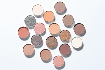 Beautiful eyeshadow refill pans on white background, flat lay
