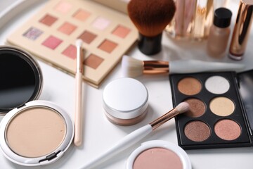 Obraz na płótnie Canvas Different makeup products on white table, closeup
