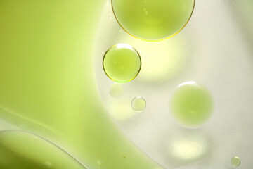 Abstract Art with Colorful Bubble Forms in Green Liquid Background