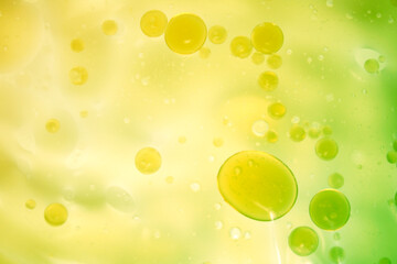 Colorful Abstract Background with Floating Bubbles in Green and Yellow
