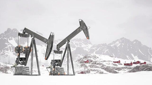Oil Rigs Operate in Snowy Landscape With Mountains and Cabins in View