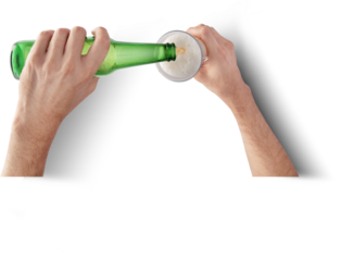 A person pouring a beverage from a green bottle into a glass, creating a frothy head.