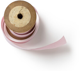 A wooden spool holding a pink ribbon, often used for crafts, sewing, or decorative purposes.
