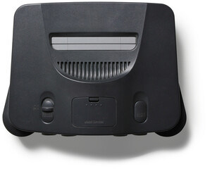 Obraz premium A classic gaming console designed for playing video games, featuring a cartridge slot and control buttons.