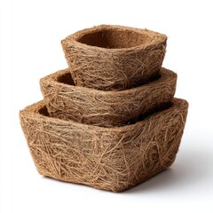 Obraz premium Three square, nested coconut fiber planters; light brown, fibrous texture; natural, biodegradable