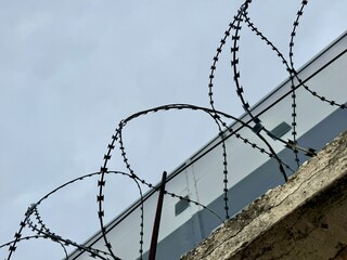 metal wire, fence on the background of the sky. High quality photo