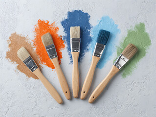 wooden paint brushes and paint on a white background watercolor paint in colors