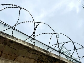 metal wire, fence on the background of the sky. High quality photo