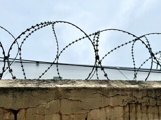 metal wire, fence on the background of the sky. High quality photo
