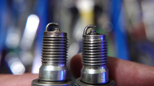 Close-Up of Automotive Spark Plugs Showing Wear and Usage