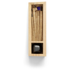 A wooden box containing various writing tools and an ink bottle, designed for calligraphy or artistic writing.