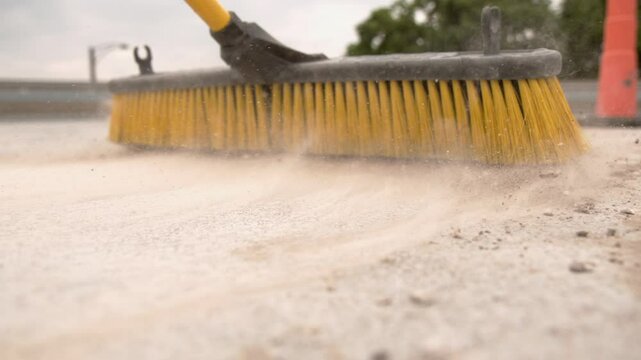 Dust cloud formed by push broom slow motion
