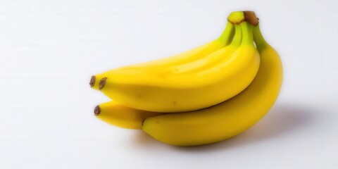 Close-up of a bunch of bright yellow bananas on a white background.