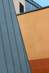Parts of the wall and roof of the building as a geometric composition and background.