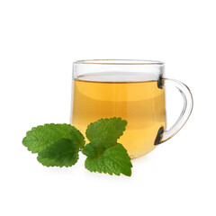 Aromatic lemon balm tea in glass cup and fresh leaves isolated on white