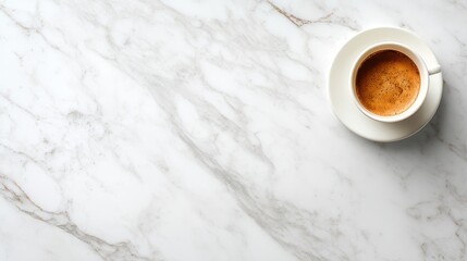 Elegant white marble surface with a cup of fresh brewed coffee in a white ceramic mug top view