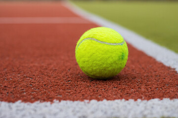 Tennis Ball Lying on Court Surface