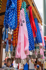 Fototapeta premium Andujar, Jaen Province, Andalusia, Spain. Religious medallions for sale at the annual pilgrimage for the Virgen de la Cabeza, Our Lady of Cabeza.