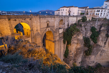 Ronda, Malaga, Andalusia, Spain. Evening view of the bridge into the village of Ronda.