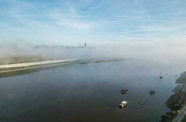 Experience the magic of the Loire Valley shrouded in morning mist, with tranquil waters reflecting iconic castles like Chambord and Chenonceau
