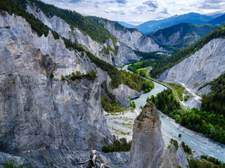 View into the canyon towards the train station Versam-Safien. Ruinaulta canyon and river Vorderrhein near Ilanz, created by the Flims rockslide and an attraction of Graubunden, Switzerland.