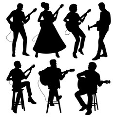 Silhouetted musicians playing acoustic guitars